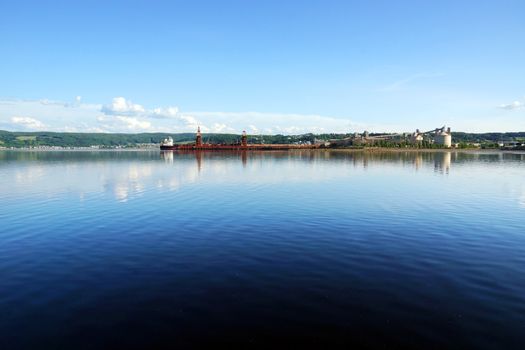 Industrial port in deep water fjord bay