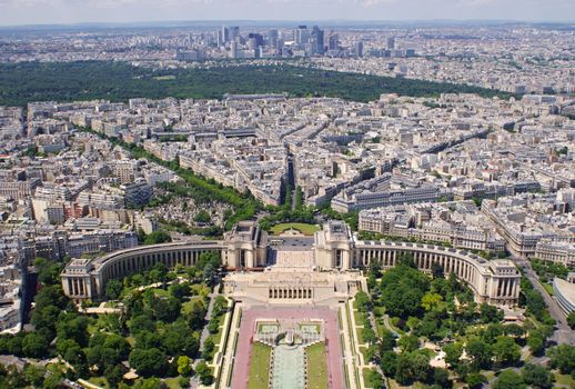 Photo is showing various views onto Paris, France with its many houses and roofs.