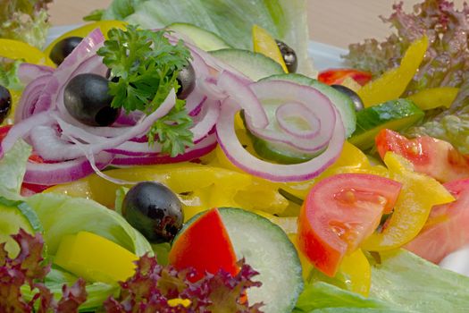 Photo shows details of various vegetable salad ingredients.