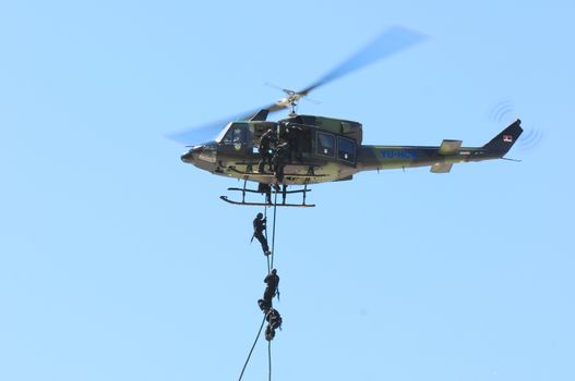 SERBIA, BELGRADE - APRIL 29, 2012:  Serbian police force in action during a helicopter demonstration at a Gendarmerie day