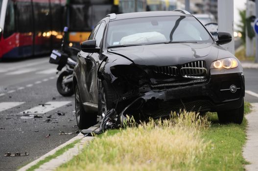 SERBIA, BELGRADE - MAY 12, 2013: Damaged black car after accident with tram. The car did not give priority to tram