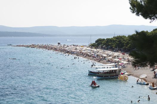CROATIA, ISLAND BRACH - AUGUST 8, 2011: Zlatni Rat (Golden Cape) is a popular beach in the Town Bol which is on the south of the island of Brac in the Split-Dalmatia County of Croatia