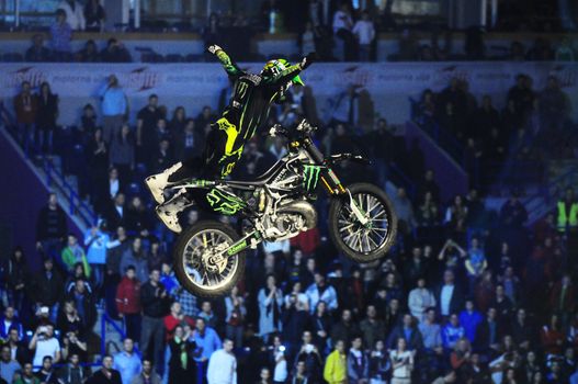 SERBIA, BELGRADE - APRIL 26, 2012: Bike rider performing the trick at Masters of dirt show, most thrilling and spectacular freestyle motocross show