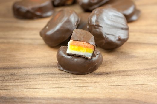 Peppermint patties filled with white, yellow, and orange colored filling.