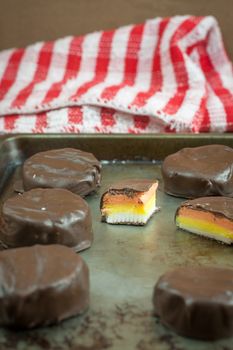 Peppermint patties filled with white, yellow, and orange colored filling.