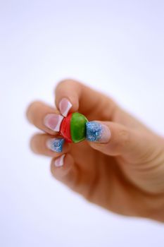 Two colors paintball ball in woman hand