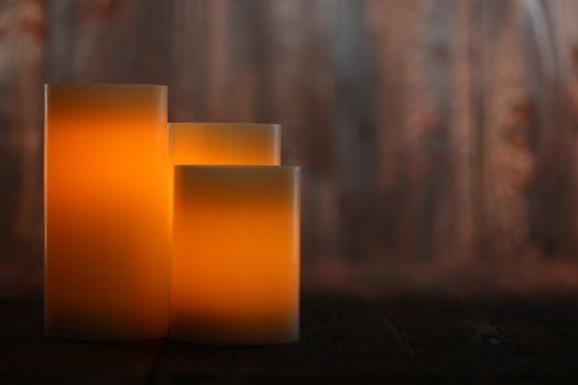 Candle on an Old Wooden Rustic Background