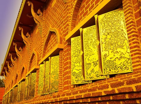 The Golden Windows Art of Buddhist Temple like Gold in sunlight.