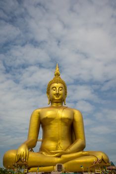 A big Buddha statue in the temple of Thailand.