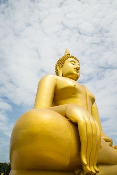 A big Buddha statue in the temple of Thailand.