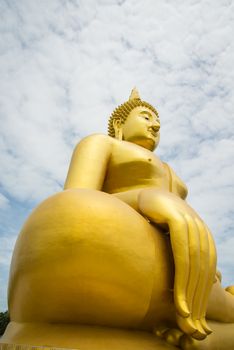 A big Buddha statue in the temple of Thailand.