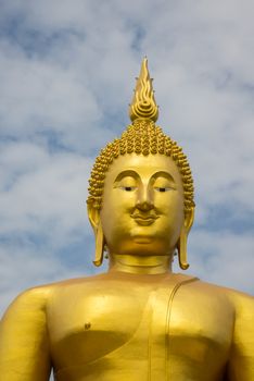 A big Buddha statue in the temple of Thailand.