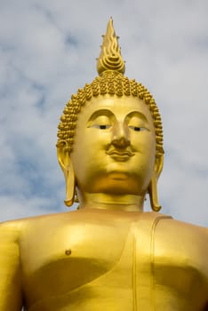 A big Buddha statue in the temple of Thailand.