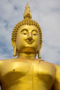 A big Buddha statue in the temple of Thailand.