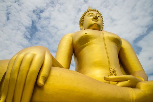 A big Buddha statue in the temple of Thailand.