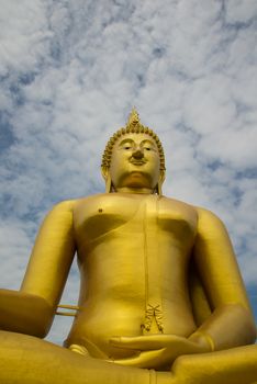 A big Buddha statue in the temple of Thailand.