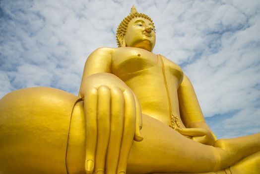 A big Buddha statue in the temple of Thailand.
