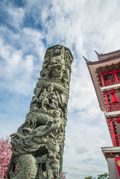 A pillar carvings dragon in the China temple in Thailand.