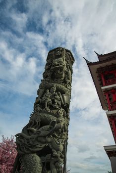 A pillar carvings dragon in the China temple in Thailand.