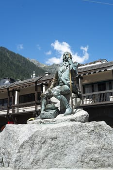 CHAMONIX, FRANCE - SEPTEMBER 02: Bronze statue of Michel Gabriel Paccard. In 1786, alongside Jaques Balmat, he was the first person to reach Mont Blanc's summit. September 02, 2014 in Chamonix.