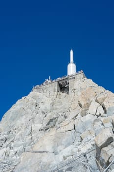 CHAMONIX, FRANCE - SEPTEMBER 02: Low angle shot of Aiguille du Midi complex. At 3842 meters, the complex offers close views of the Mont Blanc summit. September 02, 2014 in Chamonix.