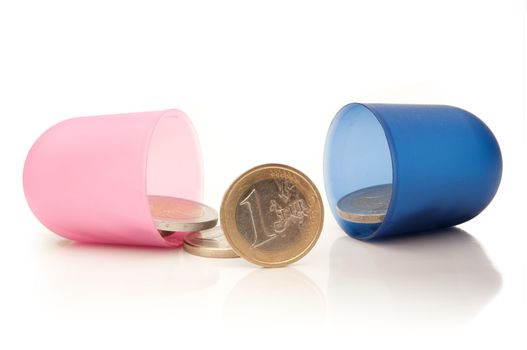 Open medicine pill with euro coins inside 