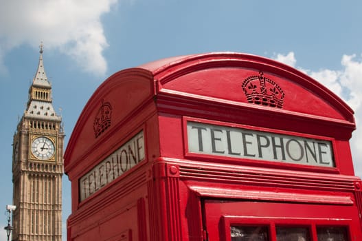 Close up of a red telephone box in London with Big Ben  in the background