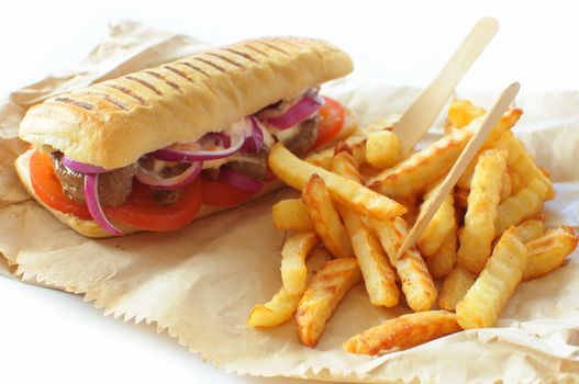 Beef sandwich with a portion of french fries takeaway