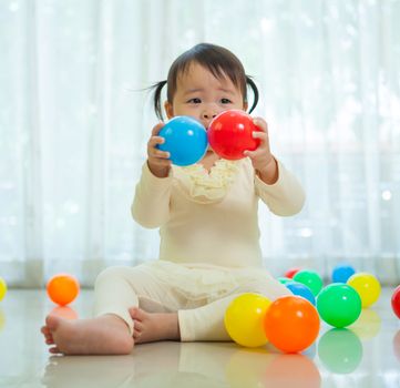 Portrait of little asian girl in home