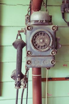 old-fashioned classic vintage telephone on the  wall