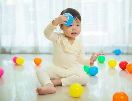 Portrait of little asian girl in home