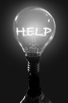 Illuminated help concept light bulb 