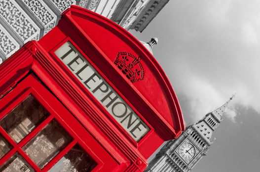 Close up of a red telephone box in London with Big Ben in the background