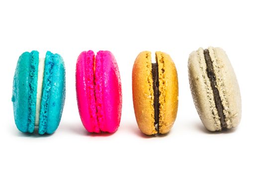 Colorful french macaroons on white background