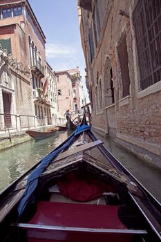 Point of view of gondola of the streets of Venice in Italy 