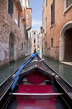 Point of view of gondola of the streets of Venice in Italy