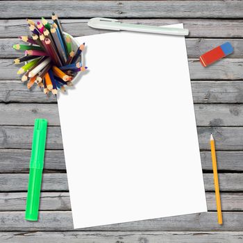 Lie on wooden floor empty paper sheet and stationery. Education concept