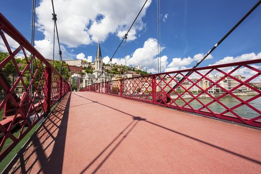view of Lyon city from red footbridge on Saone river 