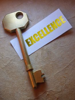 Excellence label with golden key