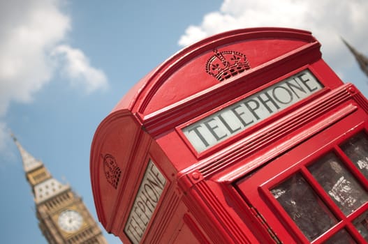 Close up of a red telephone box in London with Big Ben 
