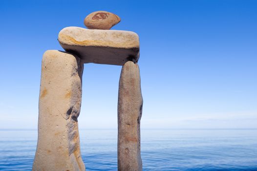 Balancing of elongated stones on the coast