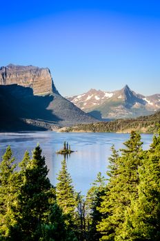 Vertical andscape view of mountain range and lake in Glacier NP, Montana, USA