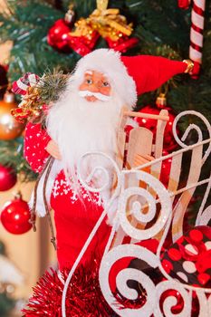Santa claus with xmas presents and christmas tree