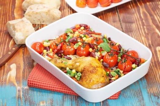Baked Chicken with Cherry Tomatoes , vegetables and spices. Macro, selective focus