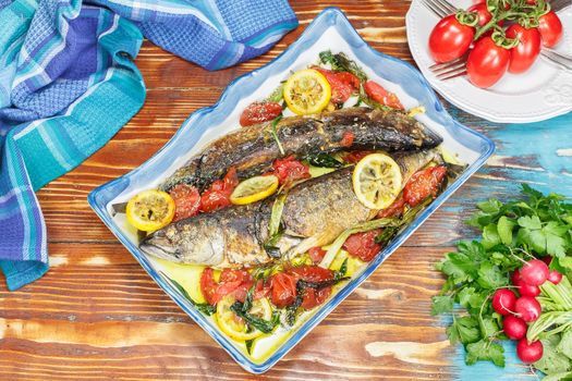 Roasted mackerel and tomatoes with garlic, basil and lemon