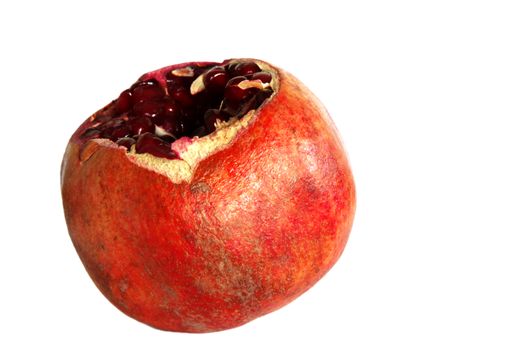 Cracked pomegranate fruit isolated on white background