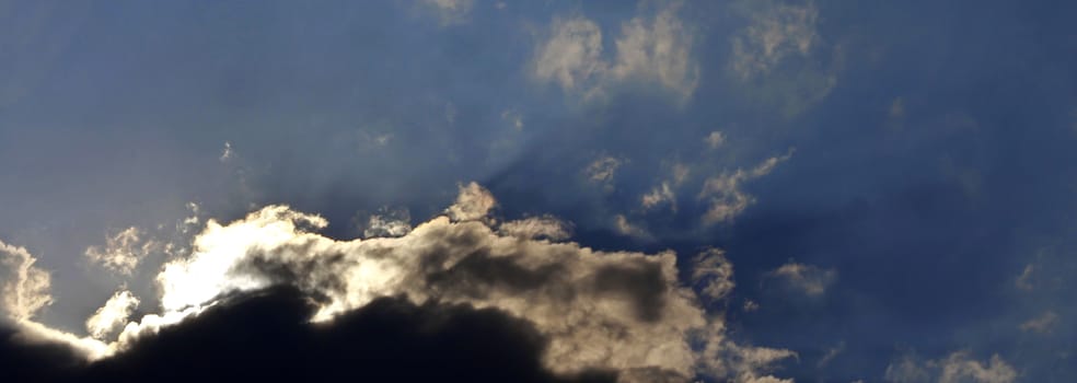 Blue sky and white clouds and the sun