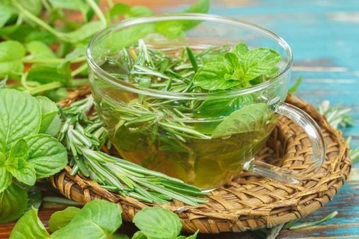 Rosemary Mint Tea with fresh rosemary and mint leaves. Phytotherapy plants and medical herbs. Macro, selective focus