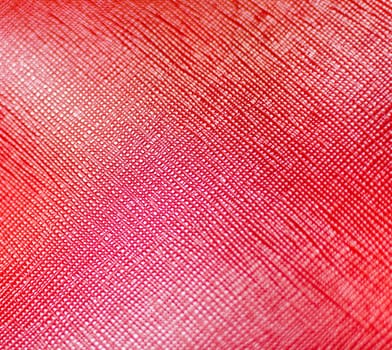Red leather texture closeup background .