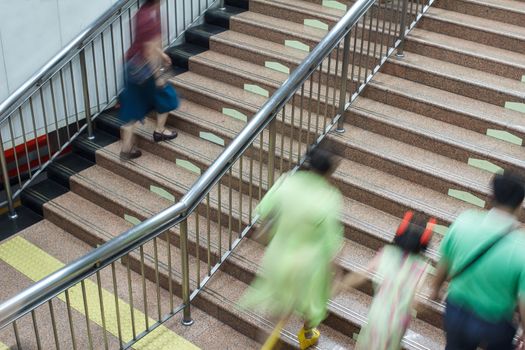 people walking on the stair in subway station
